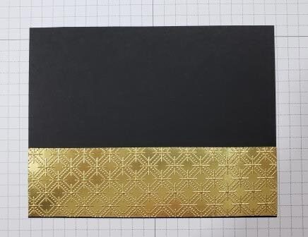 Gold embossed layer on basic black panel