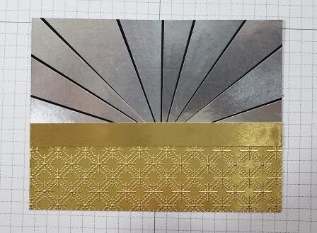 Gold and silver starburst panel with gold strip